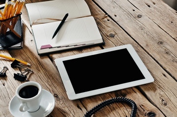 White tablet computer at office table closeup