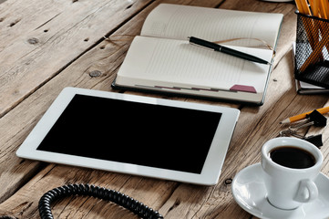 White tablet computer at office table