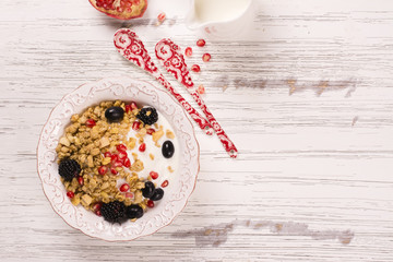 Crunchy granola with nuts, yogurt and fresh berries. Healthy breakfast concept. Top view
