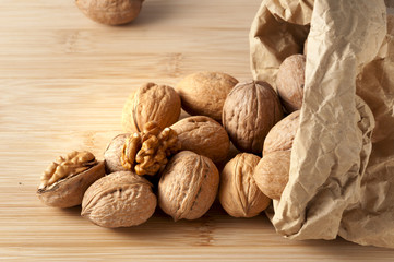 pile of walnuts in the foreground represent a healthy diet