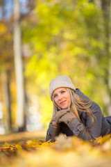 Young woman lying on leaves