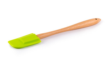 green spatula with wooden handle