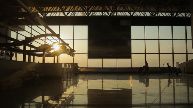 Silhouettes of travelers at the airport