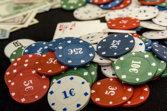 combination of poker playing cards, chips and dollar