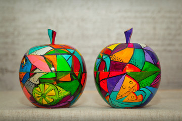 Decorative bright and colorful fruit apples on grey abstract background