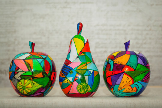 Wooden apples and pear painted by hand. Handmade, contemporary art.