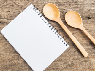 Notepad and two wooden spoons