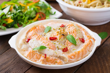 Baked slices of red and white fish with honey and lime juice, served with fresh salad and soft noodles in miso broth. 