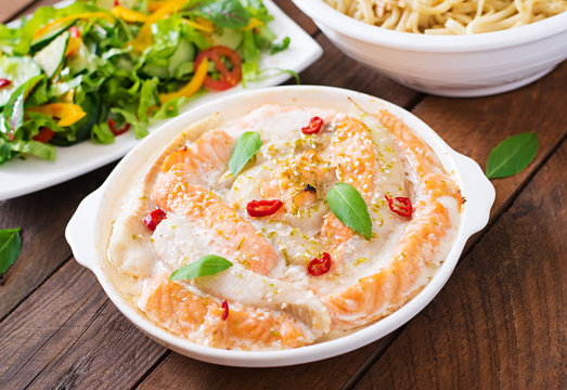 Baked slices of red and white fish with honey and lime juice, served with fresh salad and soft noodles in miso broth. 