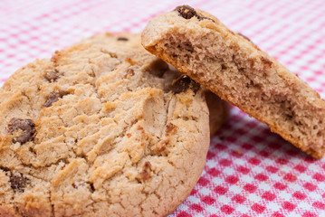 Chocolate chips cookies on red tablecloth