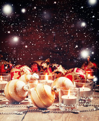 Christmas or New Year card with golden Christmas balls, candles