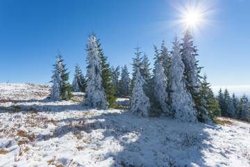 First snow in mountain against the sunlight