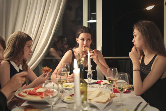 girls having dinner together 