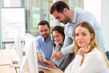 Young attractive people taking a training course with formator