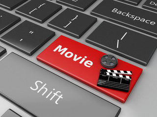 Naklejka premium 3d Clapper board and Film reel on computer keyboard.