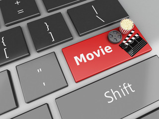 Naklejka premium 3d Cinema Clapper board, popcorn and Film reel on computer keybo