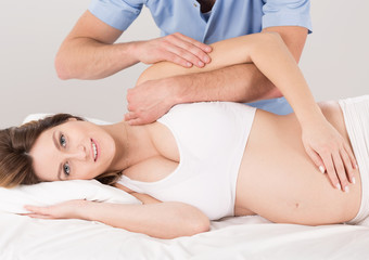 Pregnant woman at the physiotherapist