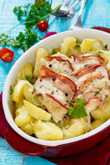Baked potatoes with chicken and bacon in a rustic style