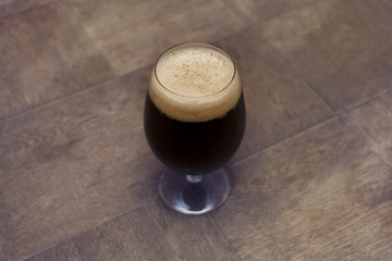 dark beer on the table, glass