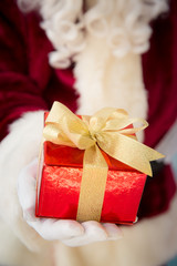 Santa Claus holding gift box