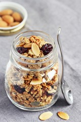 Granola with nuts,seed mix and dried cranberries. Selective focus, toned image 