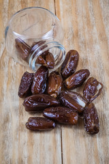 Several dried dates on a old wooden table

