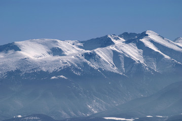 Fototapeta na wymiar Rila Mountains seen from the Vitosha Mountain. Seen ski resort of Borovets and the highest peak in the Balkans - Musala (2925 m above sea level), Bulgaria.