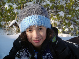 Snowy Play close up/Close up of face of child playing in the snow.