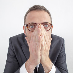 scared manager hiding his emotions for corporate mistake or silence