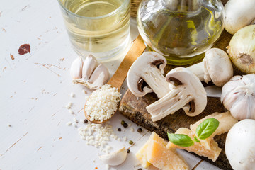 Risotto ingredients on wood board