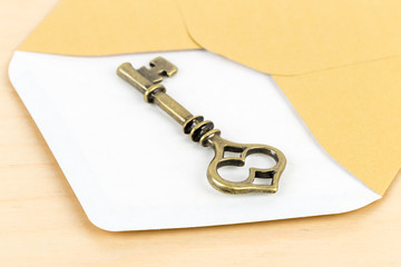 Antique key in envelope