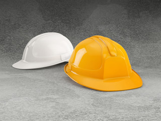 yellow and white safety helmet on grey granite