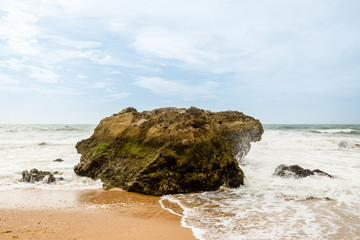 Fototapeta na wymiar Ocean crashing over rock