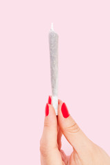 Woman holding joint.