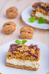 Slice of honey cake on plate and cup of coffee