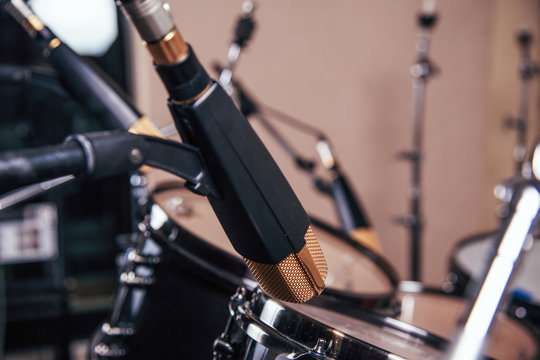 Studio microphone and drums.
