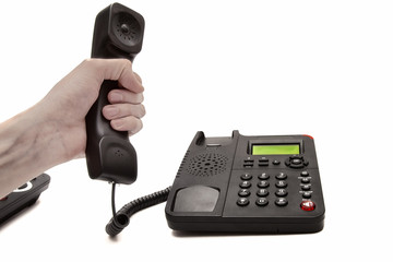 hand with the handset and phone