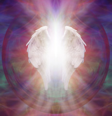 Angelic Guardian - Isolated symbolic white Angel wings with a burst of white light between on an...