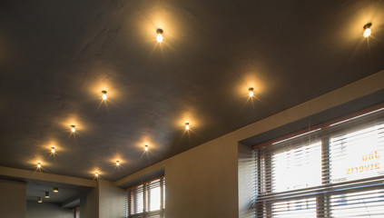 Interior of restaurant. Wooden design. Lighting and ceiling.