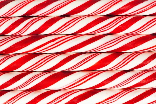 Full background of red and white striped Christmas candy canes