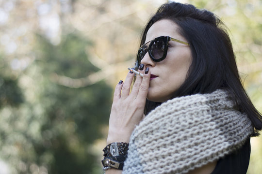 Woman smoking in park