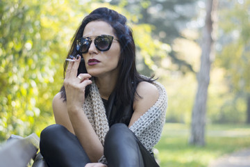 Woman smoking in park