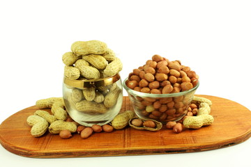 peanuts whole and peeled in white background