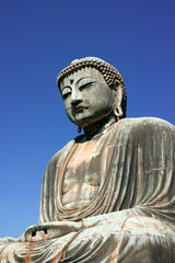 Fototapeta na wymiar The Great Buddha, Daibatsu in Kamakura Japan on a beautiful clear autumn afternoon.