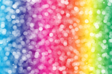 Colorful glitter sparkle defocused rays lights bokeh abstract background.