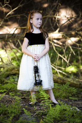 portrait of a little girl in the woods