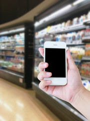 Selection of yogurts, soy milk and milk on the shelves in a supe