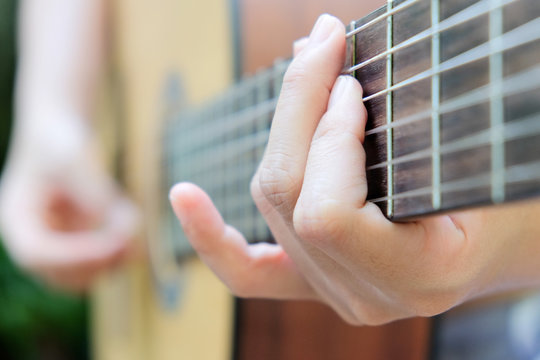 image of Man playing his acoustic guitar Background