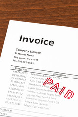 Invoice with paid stamp; invoice is mock-up