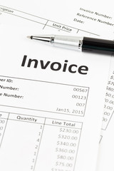 Invoice with pen; invoice is mock-up